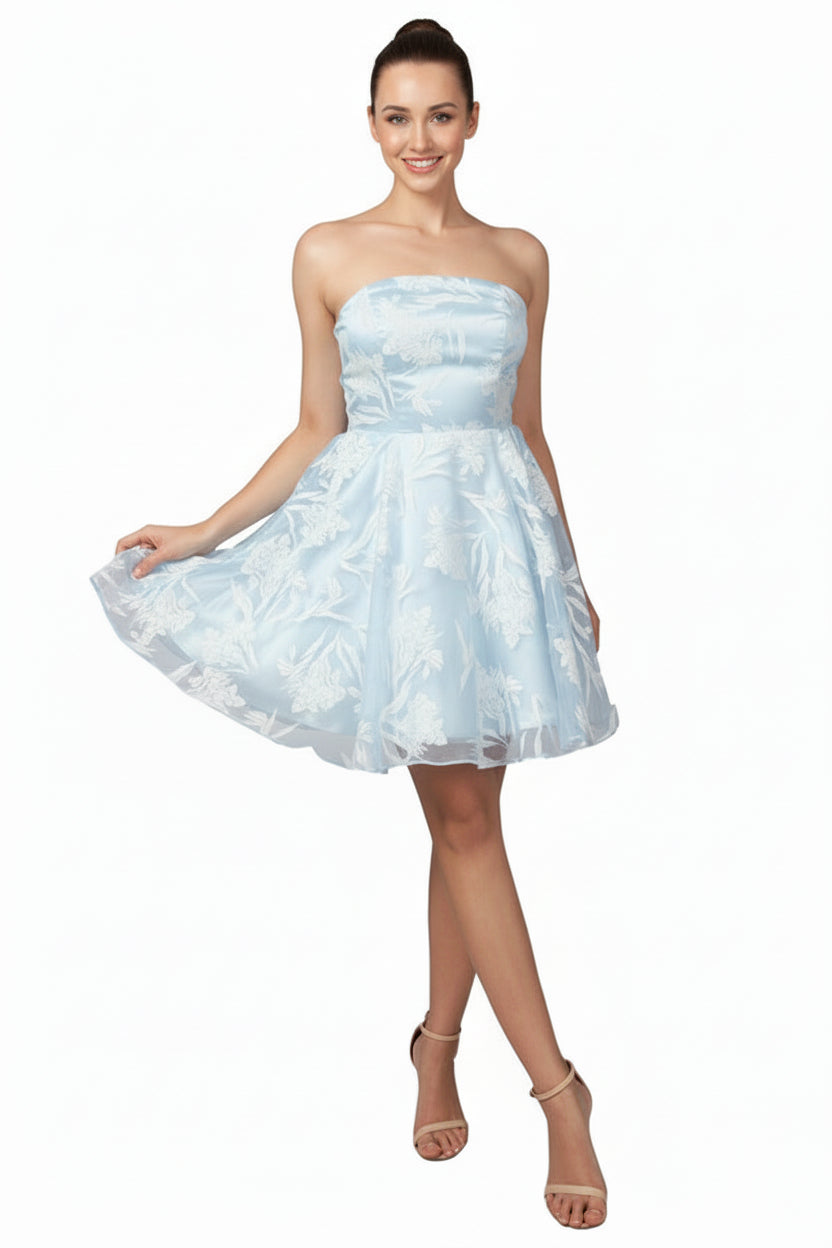 Woman wearing a light blue strapless dress on a white background